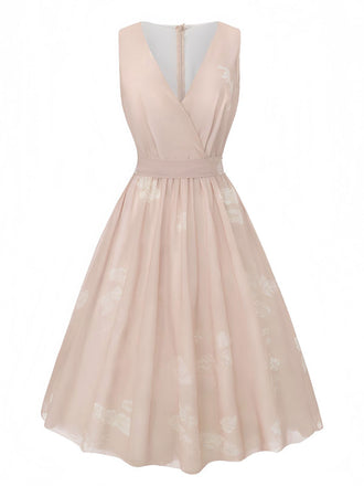 Robe rose sans manches à col V et ceinture florale années 1940