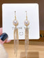 Boucles d'oreilles à pampilles en perles dorées vintage