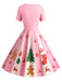 Robe trapèze rouge et verte motif flocon de neige des années 1950