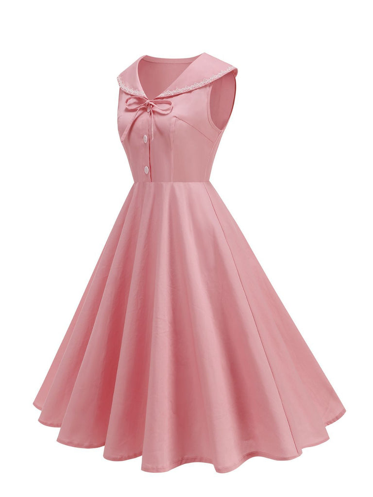 Robe sans manches col marin et nœud papillon couleur unie années 1950