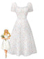 Robe blanche à fleurs col carré et manches bouffantes années 1930