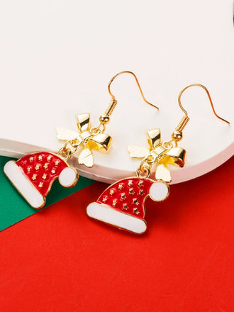 Boucles d'oreilles en strass et chapeau de Noël et un flocon de neige