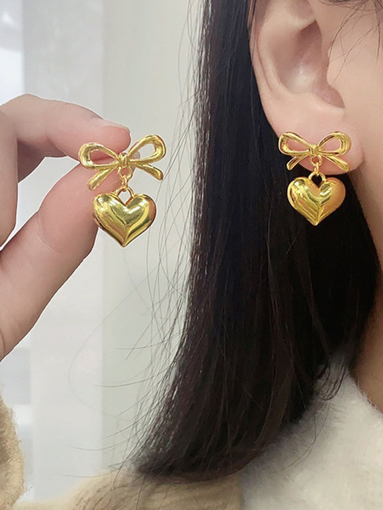 Boucles d'oreilles pendantes en alliage avec nœud en forme de cœur