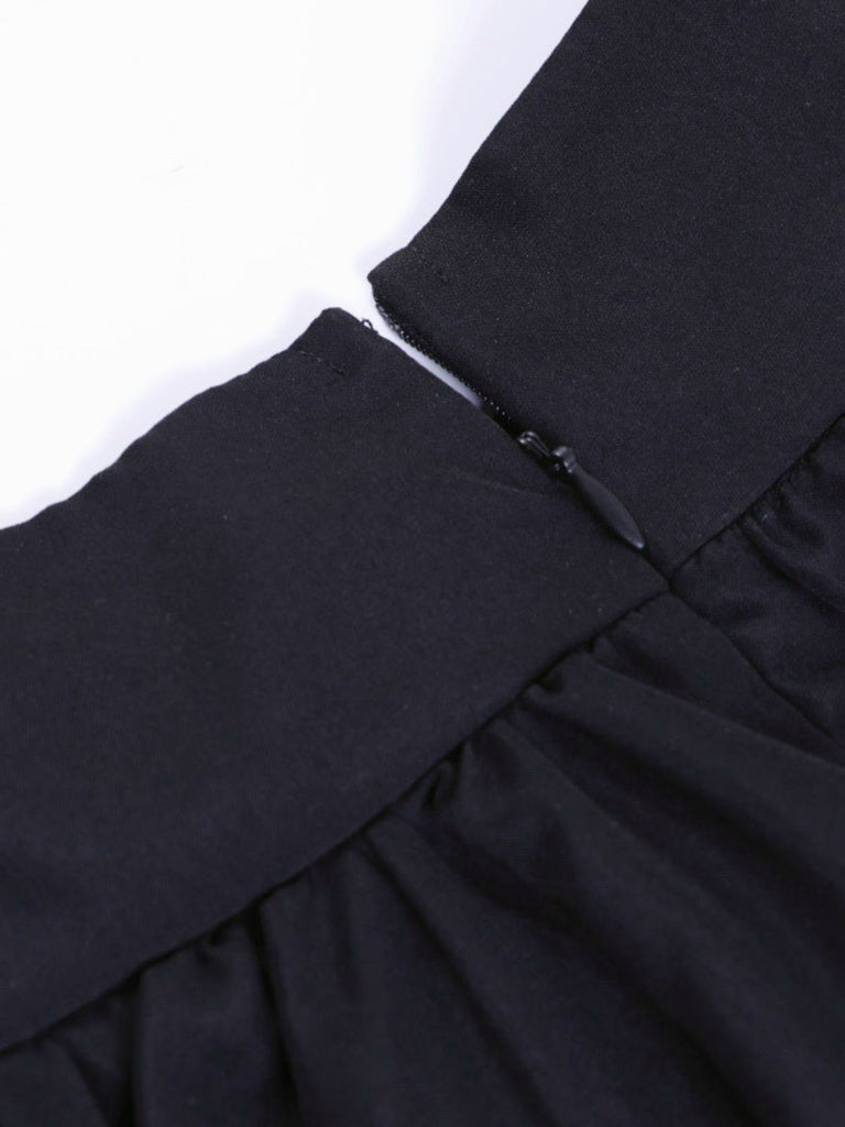 Jupe noire gothique dentelle croisée et chaîne années 1980