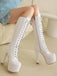 Bottes à talons aiguilles en cuir verni
