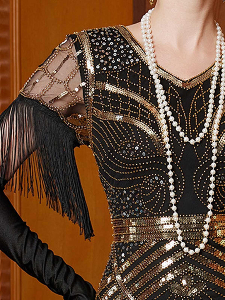 Robe longue à sequins dorés col en V et pompons années 1920