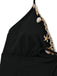 Black halter top with shell and lace details on a white background