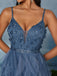 Blue evening gown with floral embellishments and a sheer overlay.