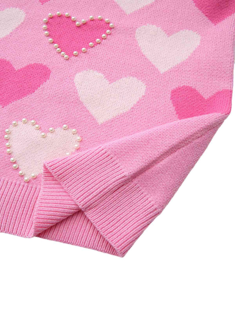 Pull rose perles en forme de cœur années 1950