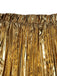 Close-up of a gold metallic pleated skirt on a white background