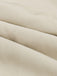 Close-up of beige fabric with a subtle texture