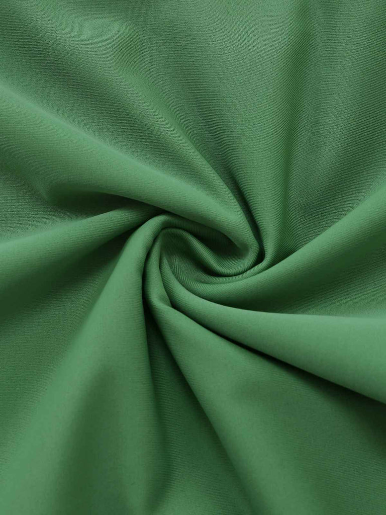 Green 1950s vintage leopard print swimsuit fabric detail close-up showing quality material texture and bold animal pattern design for retro swimwear enthusiasts