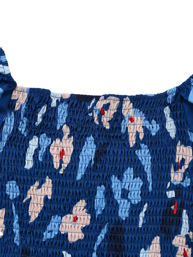 Robe bleue à fleurs manches bouffantes épaules dénudées années 1940