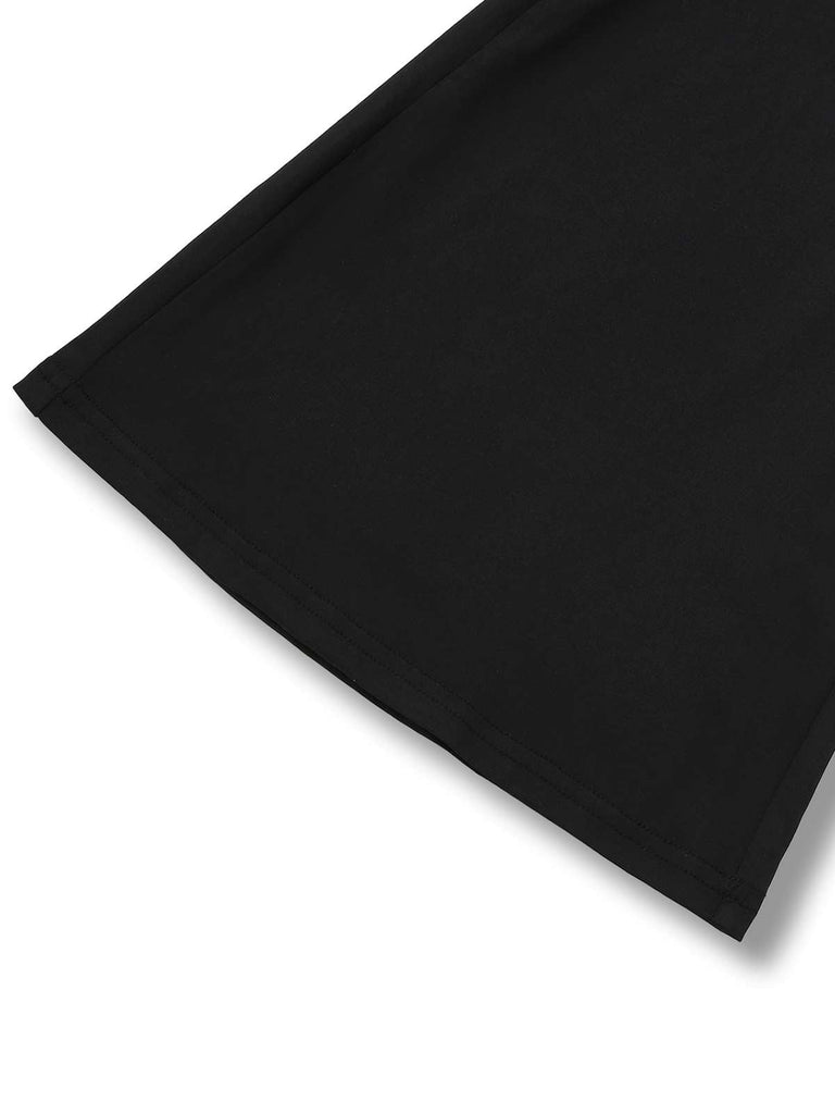 Combinaison évasée noire sans bretelles patchwork en dentelle des années 1970