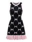 Robe noire à volants et imprimé nœud années 1960