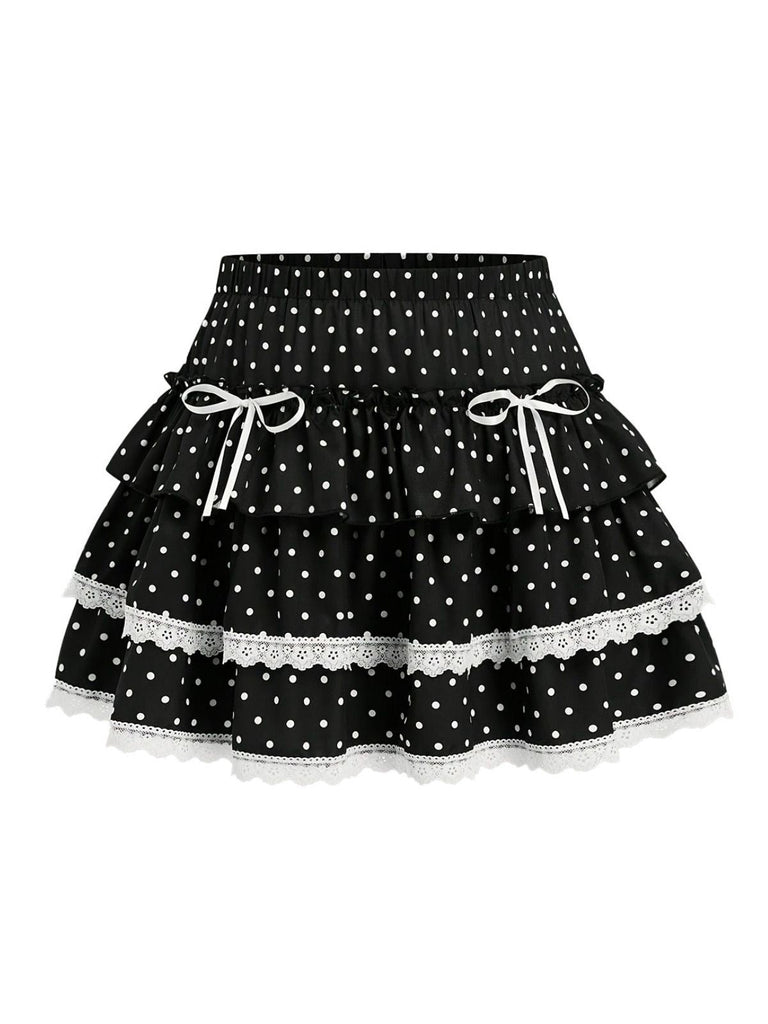 Jupe courte noire à pois en dentelle et à volants étagés, vue de face, idéale pour un style romantique et d'inspiration vintage.