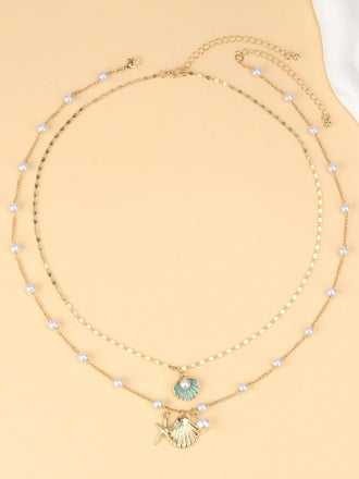 Collier superposé en coquillages perles et étoiles de mer
