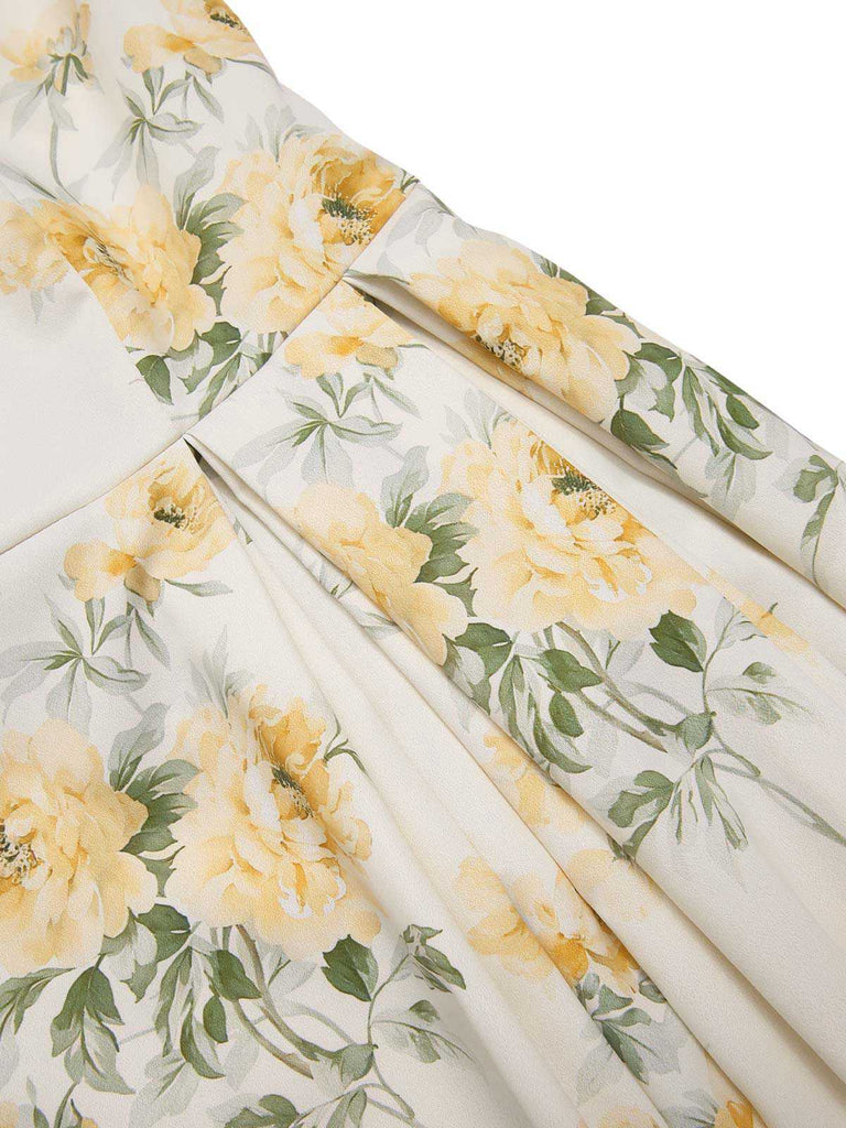 Robe jaune à fleurs antique col bateau ceinturée années 1950