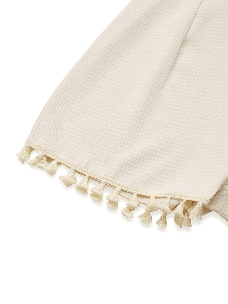 Combishort smockée beige unies à bretelles et nœuds des années 1950