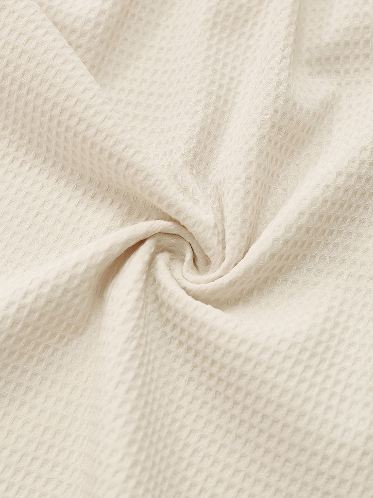 Combishort smockée beige unies à bretelles et nœuds des années 1950