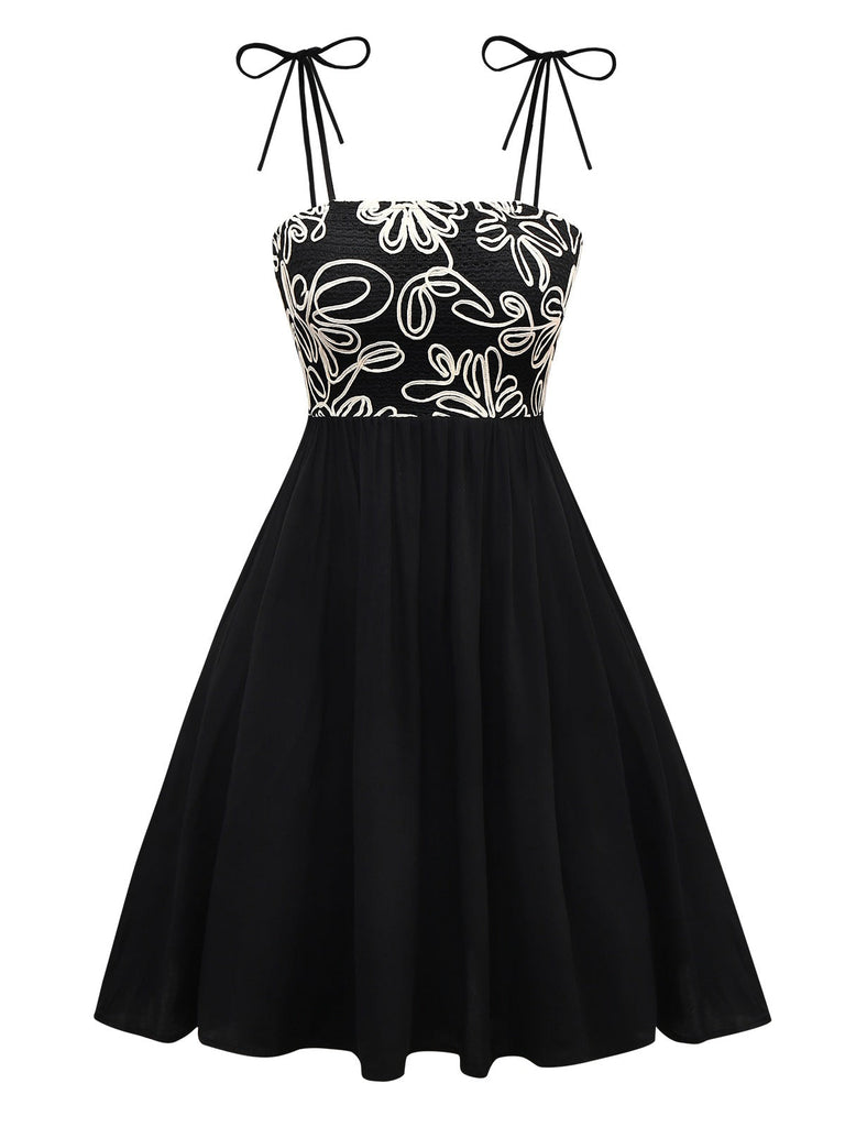 Robe noire à bretelles en nœud texturées et florales des années 1950