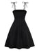 Robe noire à bretelles en nœud texturées et florales des années 1950