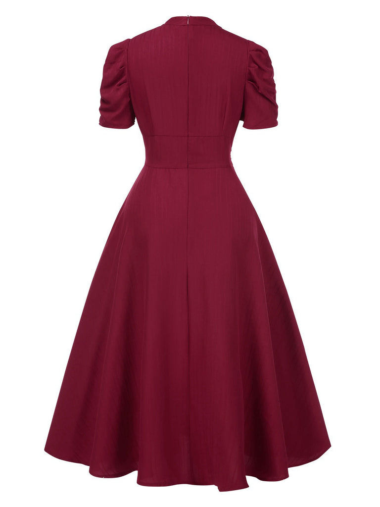 Robe manches bouffantes à col en V unie années 1950