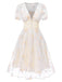 Robe blanche à fleurs brodées col V profond années 1950
