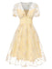Robe blanche à fleurs brodées col V profond années 1950