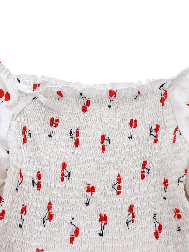Robe blanche manches bouffantes et épaules dénudées motif cerise des années 1950