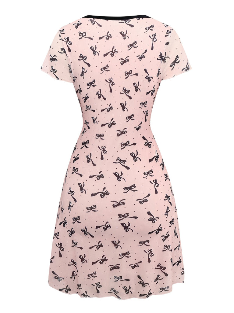 Robe rose en maille col V imprimé nœuds des années 1960