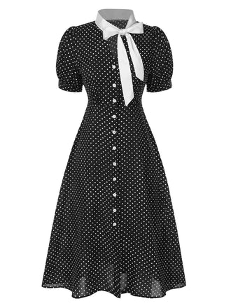 Robe noire à pois et col noué des années 40