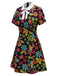 [Prévente] Robe noire à col nœud et motif floral hippie des années 1960