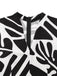 Combinaison ceinturée noire et blanche à motif de plantes des années 1950