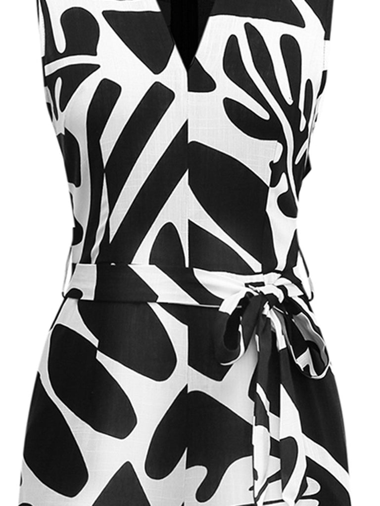 Combinaison ceinturée noire et blanche à motif de plantes des années 1950