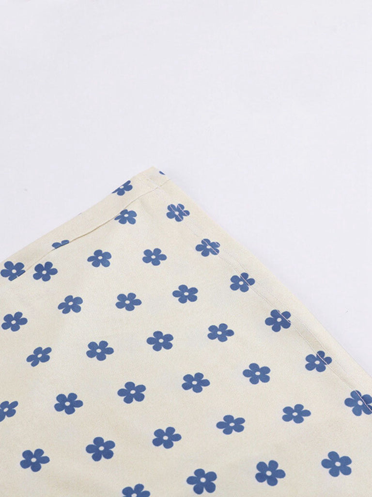 Robe à fleurs bleu et abricot larges bretelles col V profond des années 1960