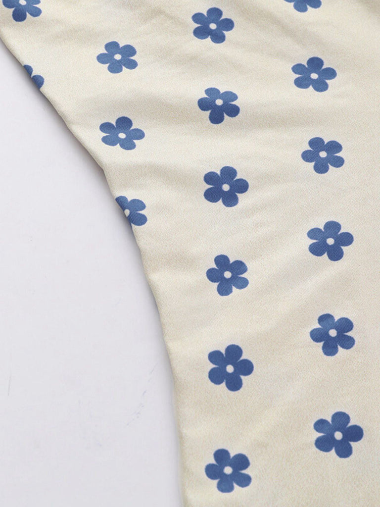 Robe à fleurs bleu et abricot larges bretelles col V profond des années 1960