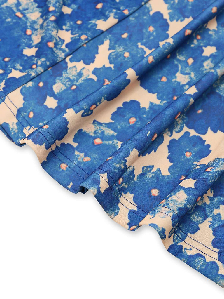Robe bleue à bretelles motif floral des années 1940