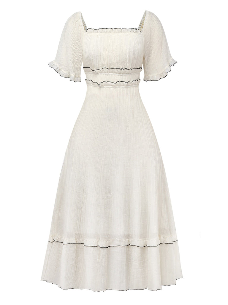 Robe abricot à col carré et bordure texturée années 1930