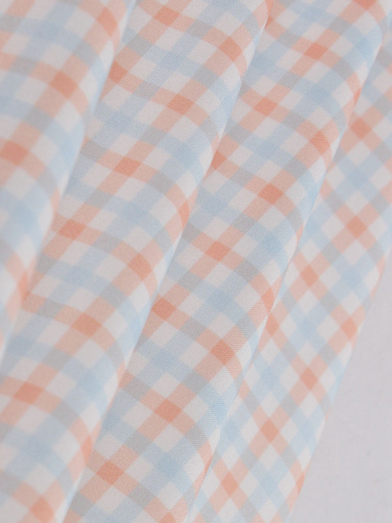 Robe blanche à bretelles spaghetti et carreaux vichy des années 1950