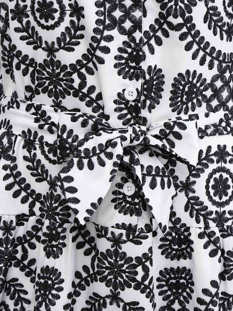 Robe noire à fleurs sans manches à revers années 1940