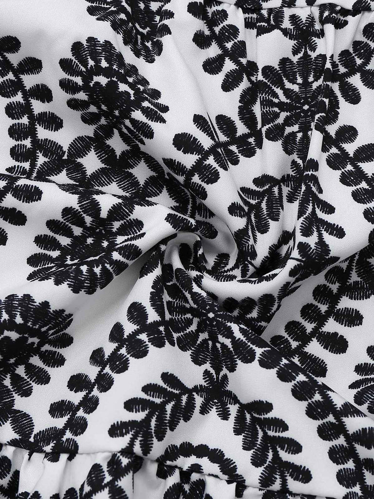 Robe noire à fleurs sans manches à revers années 1940