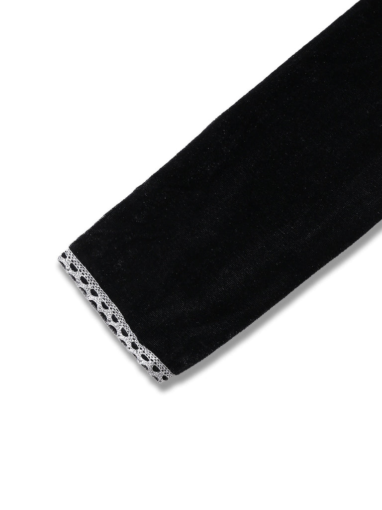 Robe noire en maille à manches longues avec tête de mort des années 1980