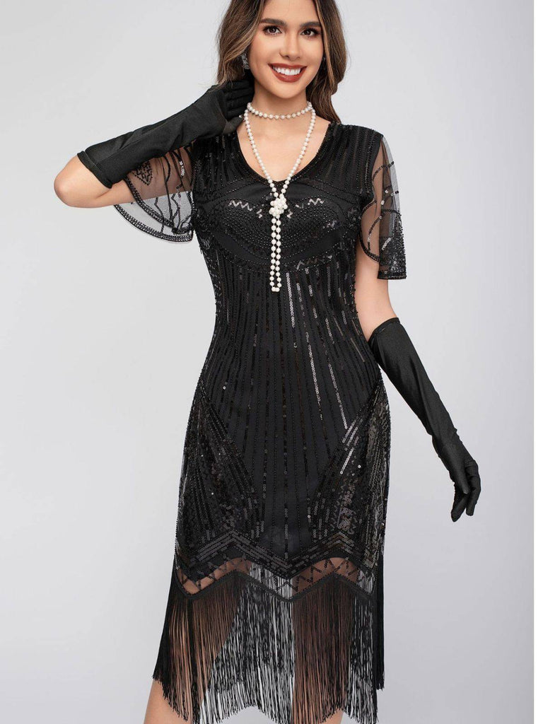 Robe Charleston à paillettes et pompons col rond années 1920