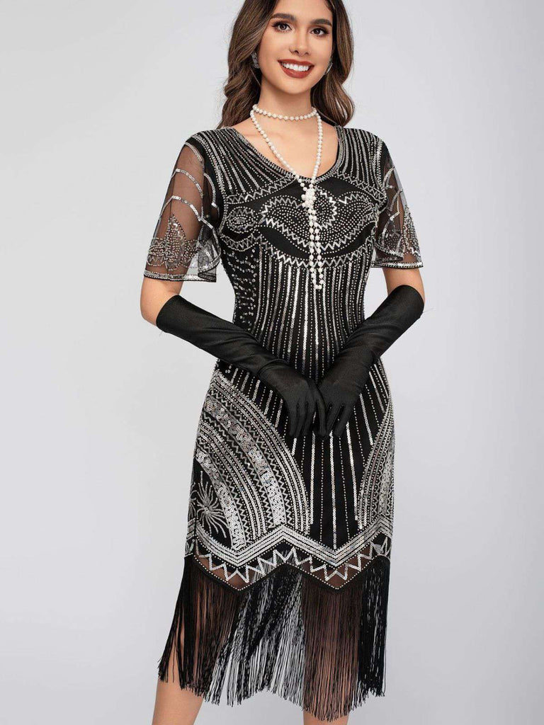 Robe Charleston à paillettes et pompons col rond années 1920