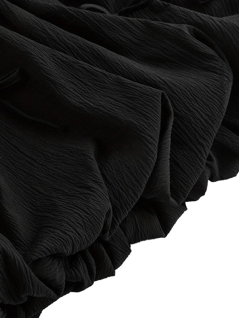 Robe patineuse noire nœuds papillon manches fines années 70