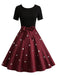 Robe trapèze noire et rouge à nœud imprimé cœur cœur années 50