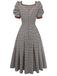 Robe plissée marron nœud et motif pied-de-poule années 1950