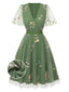Robe verte manches bouffantes et broderies florales en résille années 50