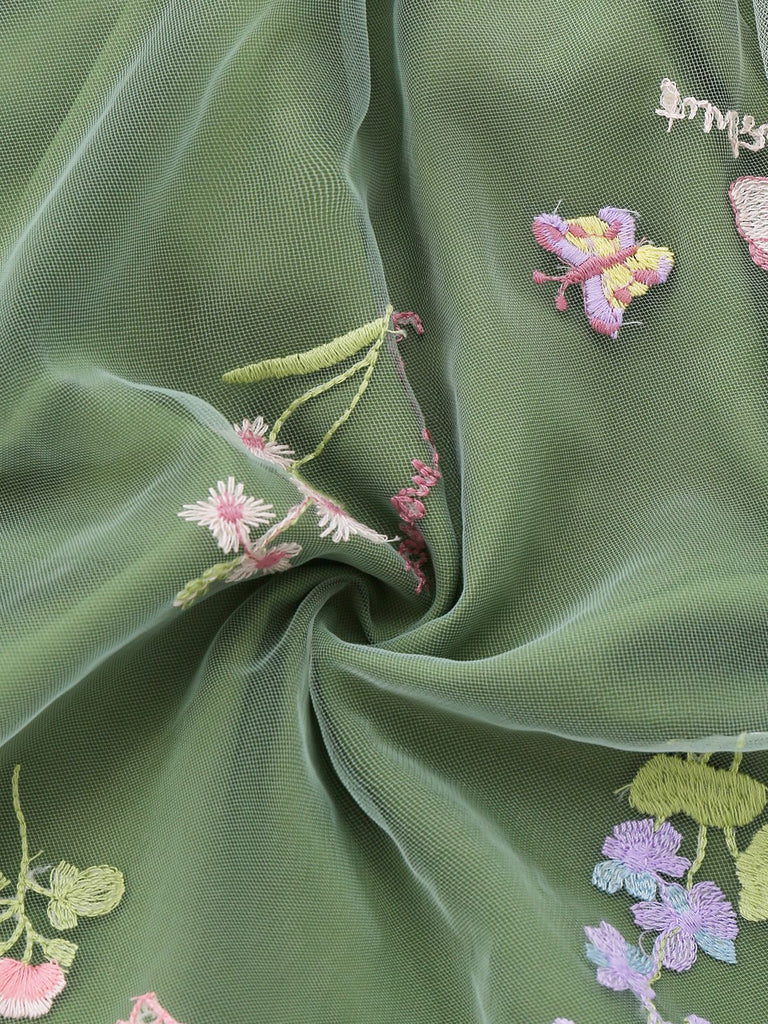 Robe verte manches bouffantes et broderies florales en résille années 50